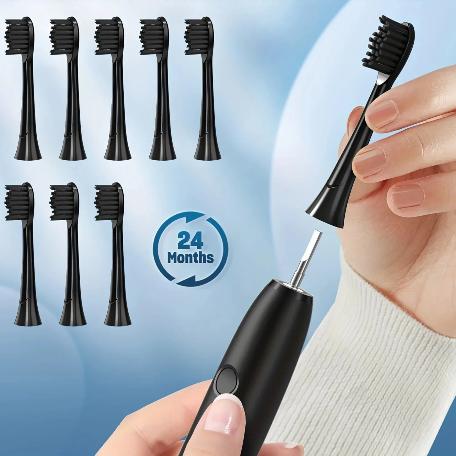 Brosse à dents électrique noire avec plusieurs têtes de brosse de rechange.