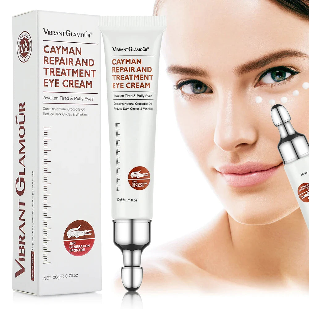 Crème pour les yeux Cayman Repair and Treatment avec un embout applicateur en forme de rouleau argenté.