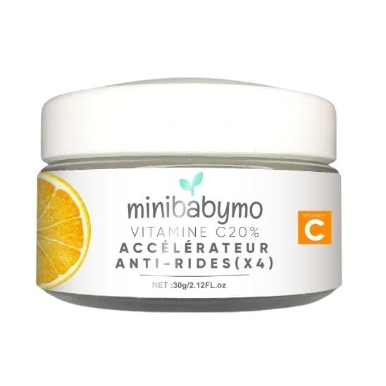 Pot de crème anti-rides à la vitamine C Minibabumo avec une tranche de citron.