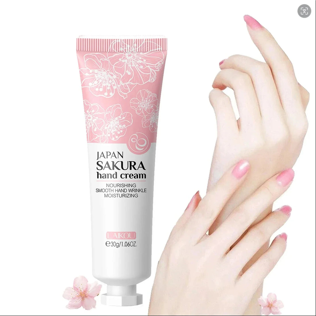 Tube de crème pour les mains Sakura rose avec motif floral et texte en japonais.