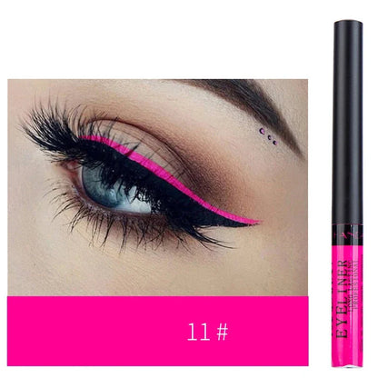 Eyeliner liquide rose vif avec applicateur noir.