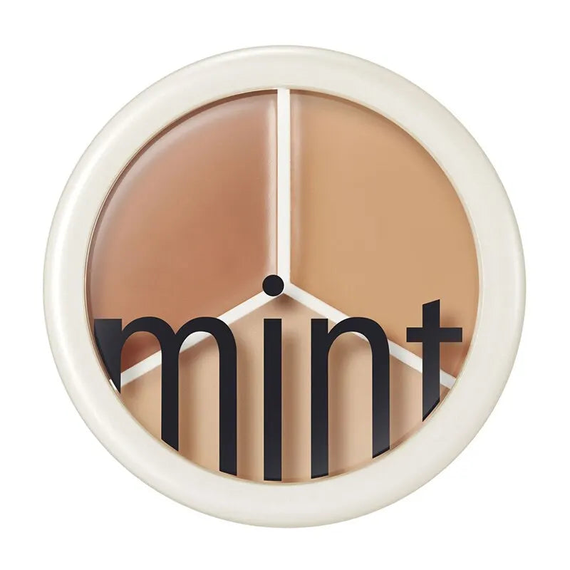 Horloge murale ronde avec texte ’mint’ et segments de couleur beige neutre.