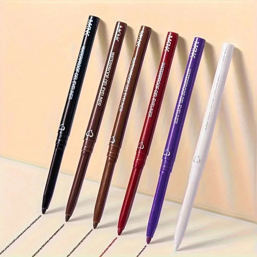 Six stylos rétractables de différentes couleurs - noir, marron, bordeaux, rouge, violet et blanc.