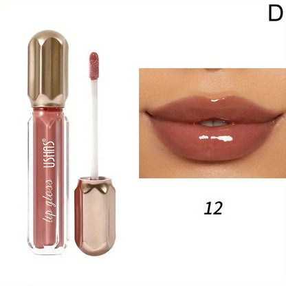 Rouge à lèvres liquide mauve brillant avec un capuchon et un applicateur métalliques dorés.