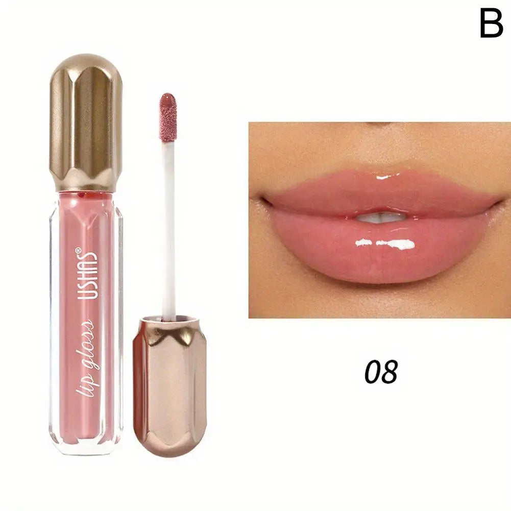 Rouge à lèvres liquide rose brillant avec un capuchon métallique doré et un applicateur.