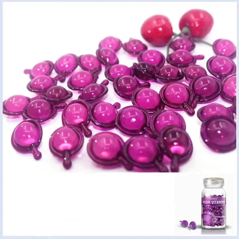 Capsules de gel remplies de liquide rose et violet ou capsules molles dispersées.