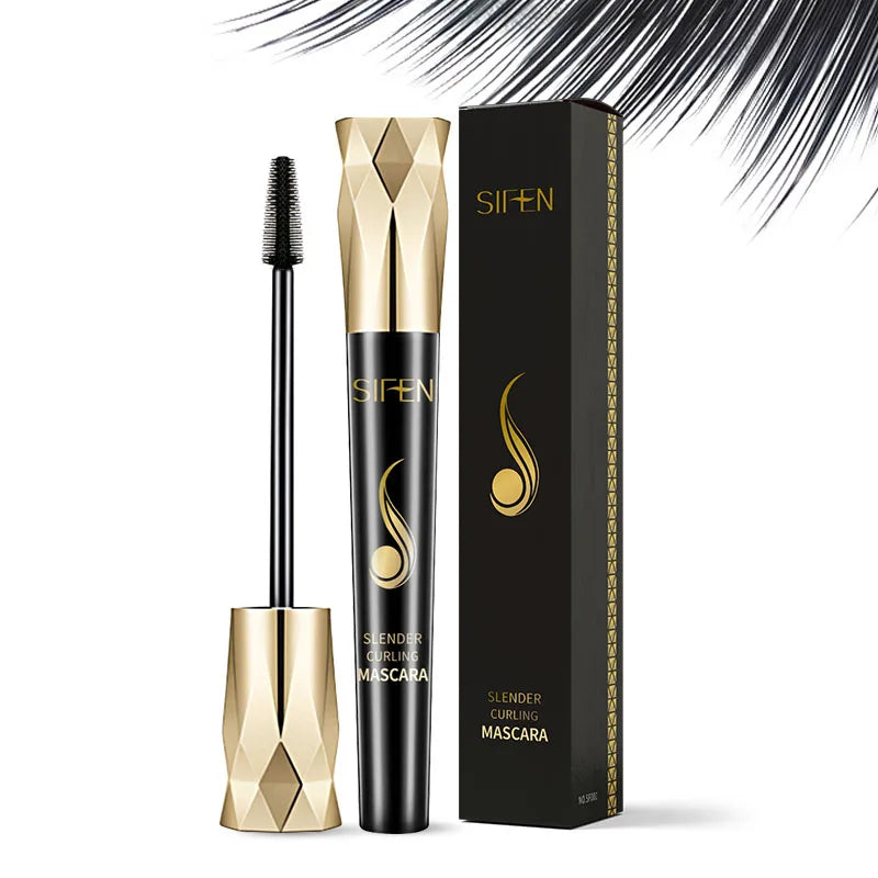 Tube de mascara noir et or avec bouchon géométrique en forme de diamant et emballage du produit.