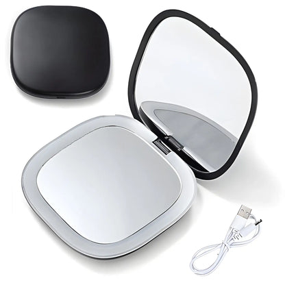 Miroir de maquillage compact avec éclairage LED intégré et câble de chargement USB.