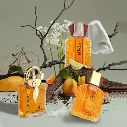 Flacons de parfum orange avec des motifs en verre ornés.