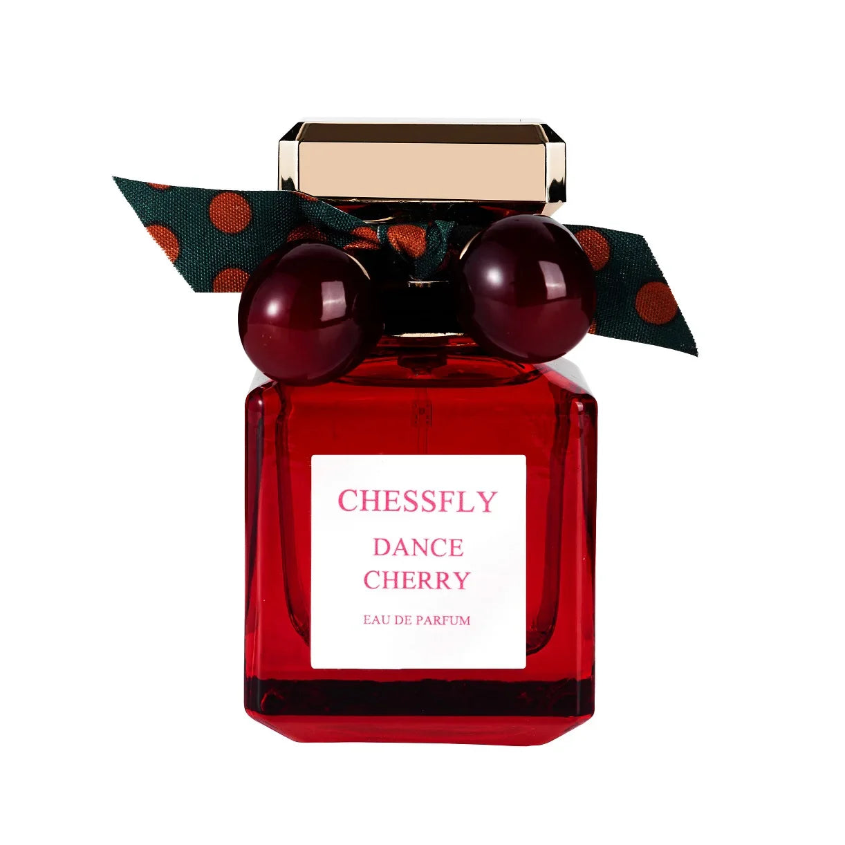 Flacon de parfum rouge avec des décorations en forme de cerises et un nœud sur le dessus.