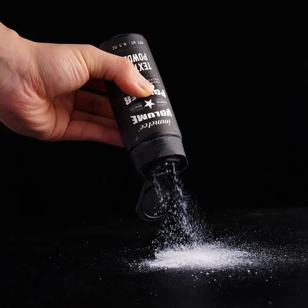 Bouteille noire distribuant une poudre blanche.