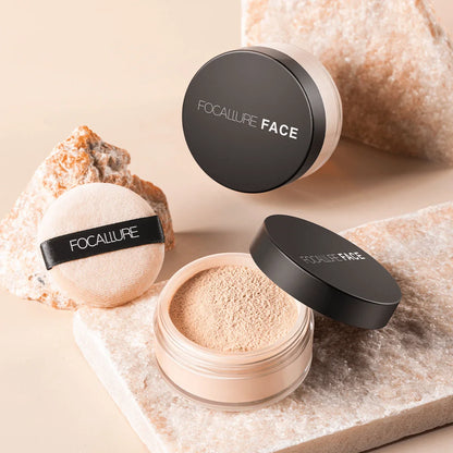 Focallure poudre libre pour le visage avec houppette dans la teinte beige/nude.