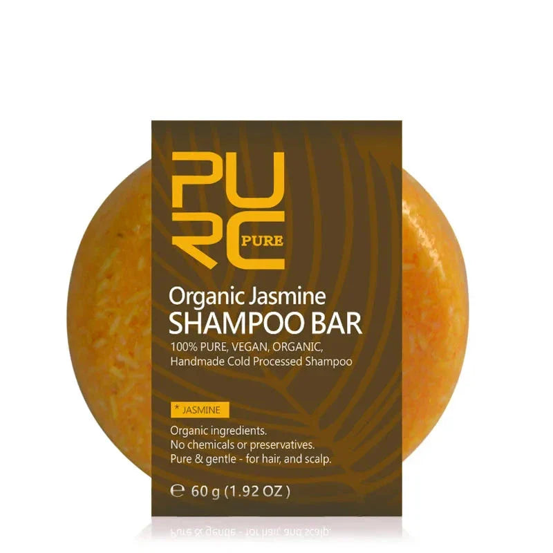 Barre de shampoing circulaire orange au jasmin biologique avec étiquette brune.