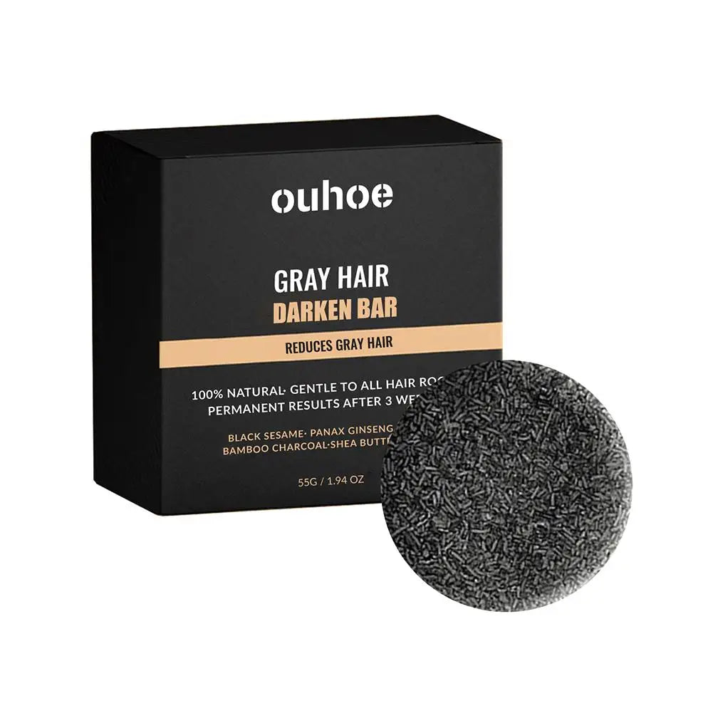 Barre de shampoing noir circulaire assombrissant les cheveux avec sa boîte de produits.